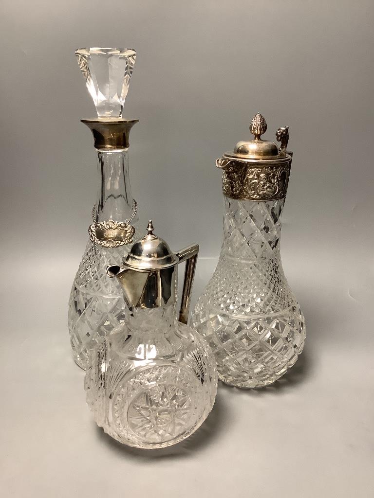 A late Victorian silver mounted cut glass claret jug, Chester, 1900, 21.6cm, together with a similar modern claret jug and decanter.